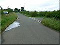 Road junction and rain, near Compton Common