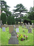 SO7119 : Churchyard St.John the Baptist Huntley by Pauline E