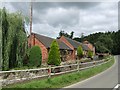 Converted barns alongside the Worthen Brook