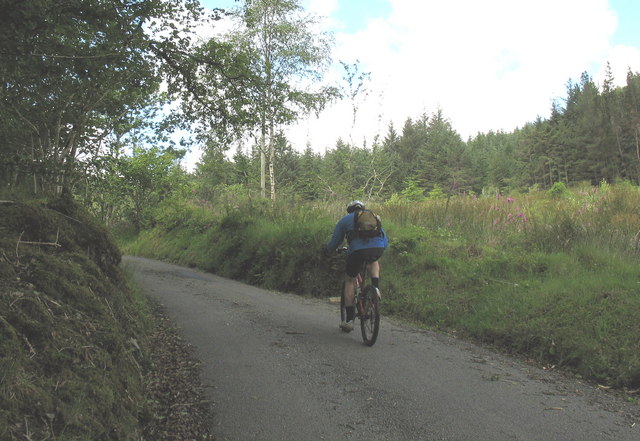 Rider on the steep hill leading to Bwlch Cwmheisian
