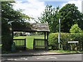 Combined bus shelter and roofed gate