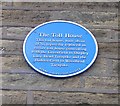 Blue Plaque on wall of Toll House Bookshop