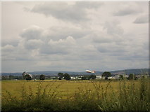 NS4768 : Plane taking off behind field near Inchinnan by Stephen Sweeney