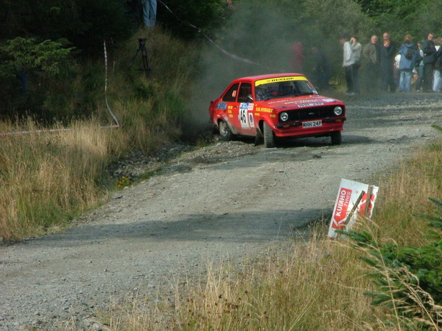 Rally car coming round a junction in Glentrool Forest