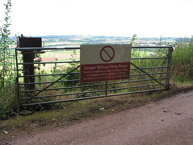 Open gate with warning notice