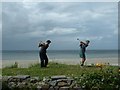 Bashing balls into the ocean outside the Argyll Hotel