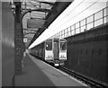 Class 313 train at  Drayton Park station