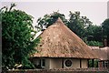 Charborough Park: thatched round lodge