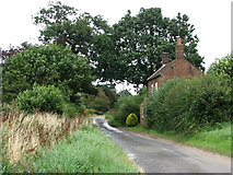 TG3529 : Crostwight Road past Foxhill Cottage by Evelyn Simak