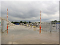 Gate into precast concrete yard.