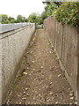 Public footpath behind garages in Yardley Hastings