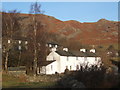 NY3103 : Terraces in Little Langdale with fells rising steeply behind by Andrew Hill