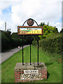 TG1334 : Plumstead village sign on Cherry Tree Road by Evelyn Simak