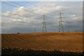 Ploughed fields and pylons