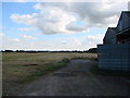 SE4862 : View from eastern side of Out Barn, over fields to Linton on Ouse RAF Station. by Bill Henderson