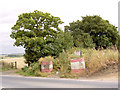 Marker signs to private landfill site.