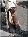 Cannon Barrel by the wall outside the Crosby Pub