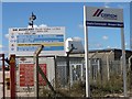 Signs at the entrance to an aggregate depot