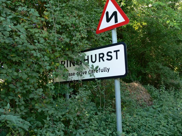 An overgrown sign for Bringhurst