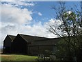 TL5778 : Barns at Nornea Farm by Alison Rawson