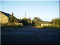 The track to Whemley Burn as it leaves the A697 road