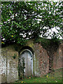 Old door in wall surrounding Fulmodeston Hall