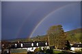 Rainbow over cottages