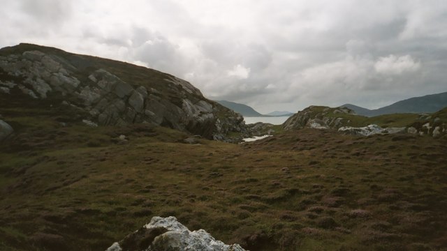 A View looking South over the Island of Liongam to Scarp, the North Harris Hills and Taransay beyond
