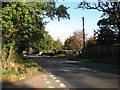 Looking north on the B1149 (Holt Road)