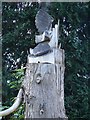 Owl carved from dead tree