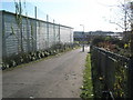 Looking down alleyway towards mammoth Tesco