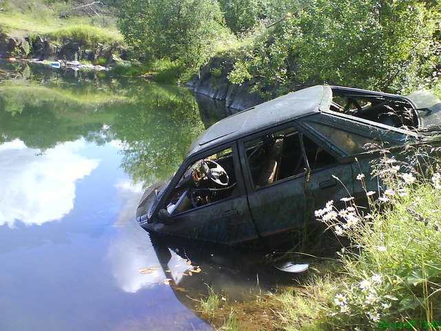 Abandoned Ford Escort in old quarry