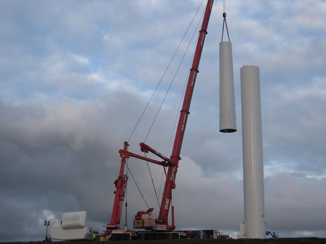 Top section of turbine tower 21 being lifted into position