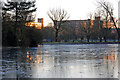 Mill scene across a frozen lake