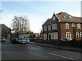 Number 21 bus by refurbished flats