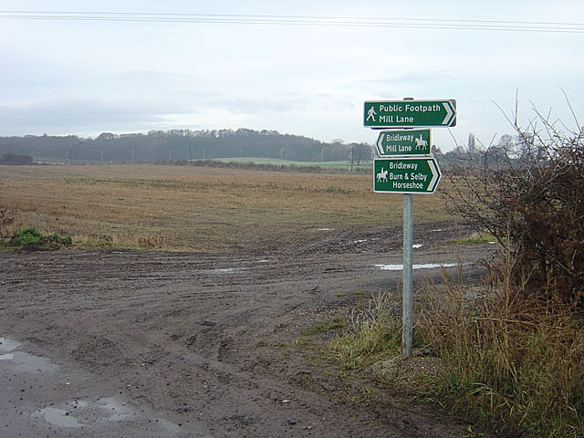 Footpath and bridleway signpost near Burton Hall