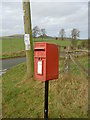 Post-box by the road junction.