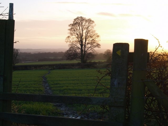 Stile into another muddy field