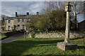 Sundial and houses in Coberley