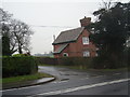 SJ4917 : House alongside A528 at Broadoak by Row17