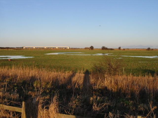 View across farmland to the railway line