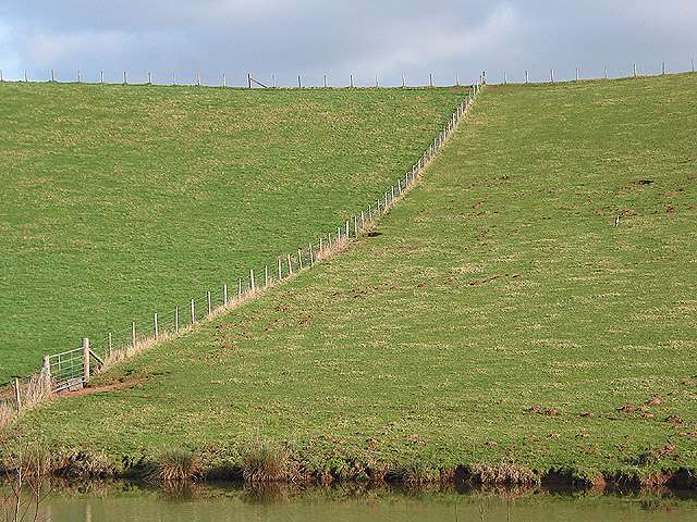 Fence sweeping down a hillside