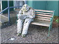 Paper Mache sculpture of person reading a book