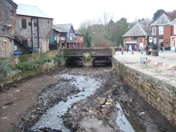 Stream bed, former leat, Exeter quay with road bridge