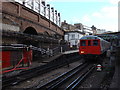 A Metropolitan line train departs from Farringdon