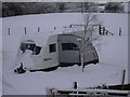 Caravan in the snow at Birch Hill Farm Caravan Club CL