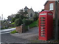 Telephone box & church at Sheinton