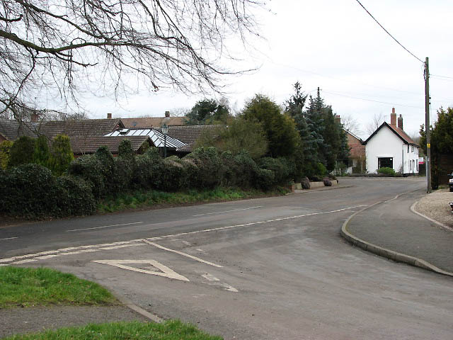 Junction of The Street with Carbrooke Road
