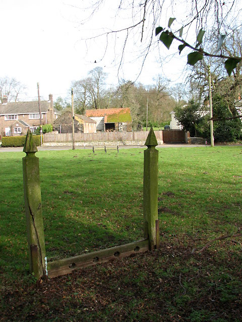 Cranworth - the stocks on the church... © Evelyn Simak cc-by-sa/2.0 ...