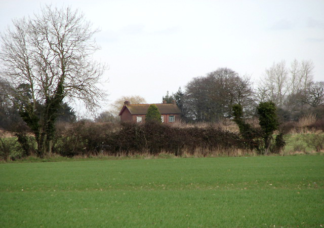 A house surrounded by fields